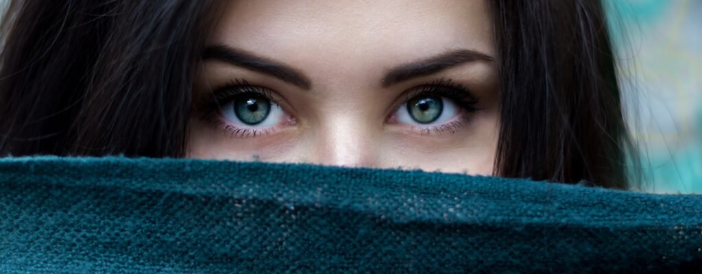 a close up of a person with blue eyes